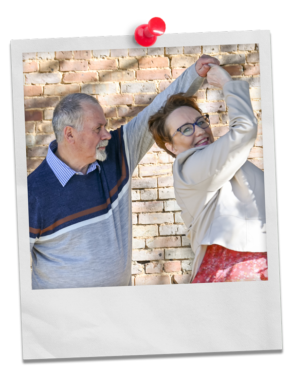 Photo of Larry Deavenport twirling his wife Delisa