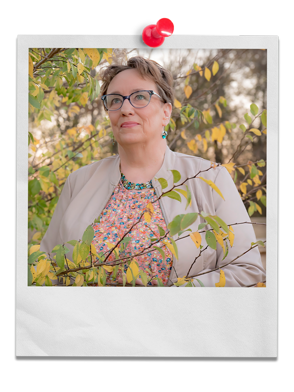 Photo of coach delisa walking amongst the trees